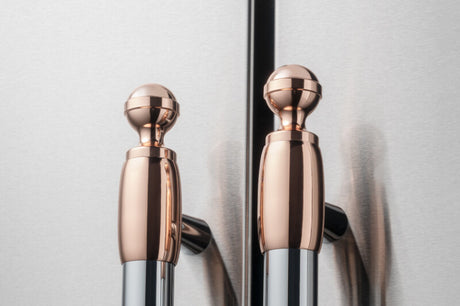 Bertazzoni DS2HERTPC BZ-DECOR SET 2 - POLISHED COPPER FINISH on refrigerator handles for luxury appliances.