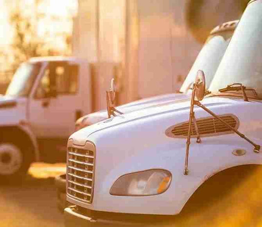 Delivery trucks ready for appliance liquidation service and nationwide shipping of discounted premium appliances.